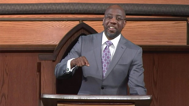 The Rev. Raphael Warnock preaches during last Sunday’s virtual service at Ebenezer Baptist Church in Atlanta. The sermon was pre-recorded in the church sanctuary.