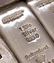 The hallmark details on one kilogram silver bars are seen at London bullion dealers Gold Investments Ltd. in this arranged photograph in London, U.K., on Thursday, April 4, 2013.
Credit:	Simon Dawson/Bloomberg/Getty Images