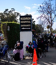 People without appointments wait in line for the potential chance to receive a Covid-19 vaccination that would have otherwise been discarded at the Kedren Community Health Center on January 25 in Los Angeles.
Credit:	Patrick T. Fallon/AFP/Getty Images