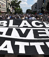 Protesters deploy a "Black Lives Matter" banner near the White House during a demonstration against racism and police brutality, in Washington, DC, on June 6, 2020.
Credit:	Olivier Douliery/AFP/Getty Images