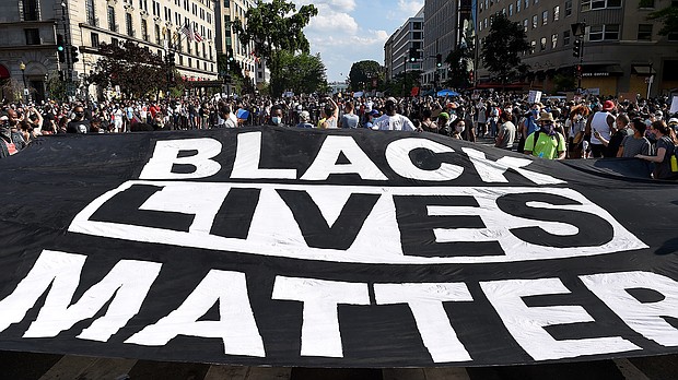 Protesters deploy a "Black Lives Matter" banner near the White House during a demonstration against racism and police brutality, in Washington, DC, on June 6, 2020.
Credit:	Olivier Douliery/AFP/Getty Images