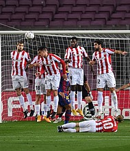 Messi scores a free-kick against Athletic Bilbao on Sunday.
Credit:	Alex Caparros/Getty Images Europe/Getty Images