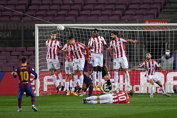 Messi scores a free-kick against Athletic Bilbao on Sunday.
Credit:	Alex Caparros/Getty Images Europe/Getty Images