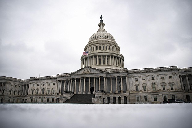 Snow covers the ground on the East Front of the U.S. Capitol in Washington, D.C., U.S., on Monday, Feb. 1, 2021.
Credit:	Al Drago/Bloomberg/Getty Images