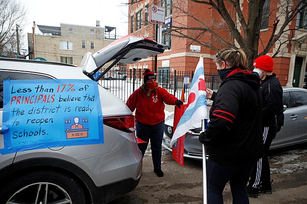 Supporters of the Chicago Teachers Union prepare for a car caravan on January 30.
Credit:	Eilee T. Meslar/Reuters
Dateline:	CHICAGO, IL, UNITED STATES