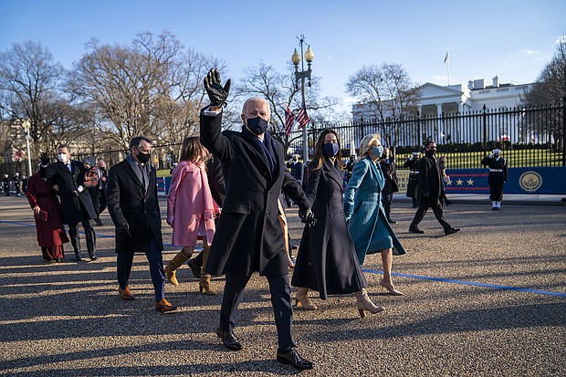 President Joe Biden, First Lady Jill Biden and family, walk in front of the White House during a Presidential Escort to the White House, Wednesday, Jan. 20, 2021 in Washington.
Credit:	Doug Mills/The New York Times/AP