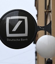 A logo outside a Deutsche Bank AG bank branch in Munich, Germany, on Wednesday, Feb. 3, 2021. Deutsche Bank is scheduled to report fourth-quarter earnings on Thursday.
Credit:	Andreas Gebert/Bloomberg/Getty Images
