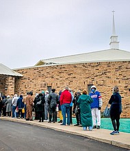 People line up for COVID-19 vaccinations outside Ebenezer Baptist Church in Oklahoma City, on Jan. 26, 2021.