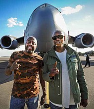 Dave Chappelle (right) and Donnell Rawlings, actors and comedians, stand in front of a C-17 Globemaster III Feb. 2, 2017, at Joint Base Charleston, S.C. Chappelle was in town for his stand-up comedy show when he made the visit to see service members and federal civilians at the base. U.S. Air Force photo/Senior Airman Tom Brading