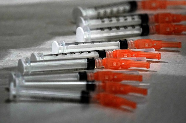 These are syringes loaded with the Moderna COVID-19 Vaccine, during a vaccination clinic hosted by the University of Pittsburgh and the Allegheny County Health Department at the Petersen Events Center, in Pittsburgh, Thursday, Jan. 28, 2021.
Credit:	Gene J. Puskar/AP