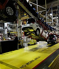 In this Monday, Jan. 28, 2013, file photo, cars move along an assembly line at the General Motors Fairfax plant in Kansas City, Kan.
Credit: Orlin Wagner/AP