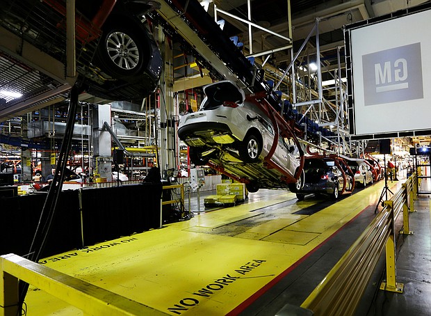 In this Monday, Jan. 28, 2013, file photo, cars move along an assembly line at the General Motors Fairfax plant in Kansas City, Kan.
Credit:	Orlin Wagner/AP