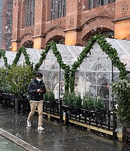 People dine in outdoor tents in NoHo during a snowstorm on February 7, 2021 in New York City.
Credit:	Noam Galai/Getty Images