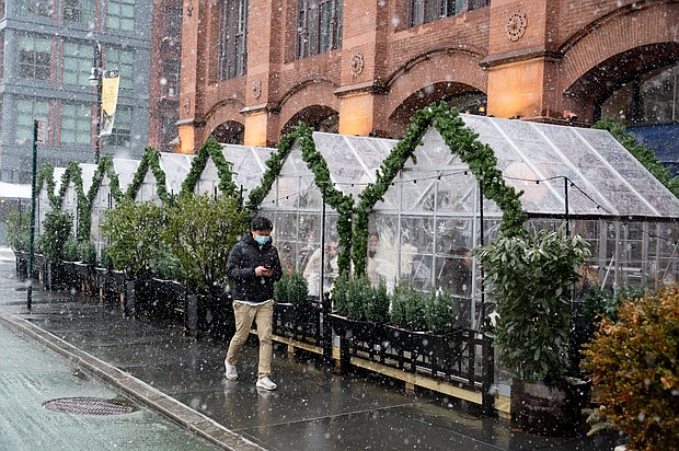 People dine in outdoor tents in NoHo during a snowstorm on February 7, 2021 in New York City.
Credit: Noam Galai/Getty Images