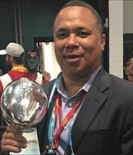 Michael Davis, personnel executive for the Kansas City Chiefs, holds the Vince Lombardi Trophy the team won as the 2020 Super Bowl champions.