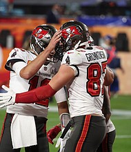 Tampa Bay Buccaneers quarterback Tom Brady (12) celebrates with tight end Rob Gronkowski
