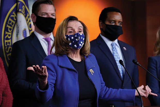 House Speaker Nancy Pelosi speaks to members of the media on Capitol Hill following the U.S. Senate’s vote last Saturday to acquit former President Trump of inciting the Jan. 6 insurrection at the U.S. Capitol. With her are House impeachment managers Rep. Eric Swalwell of Calif., left, and Rep. Joe Neguse of Colorado.