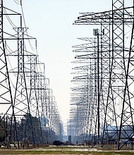 This photo shows power lines in Houston, Texas on Tuesday, Feb. 16. After the state's winter storm, some residents must change electric providers while others still don't have water.
Credit:	David J. Phillip/AP