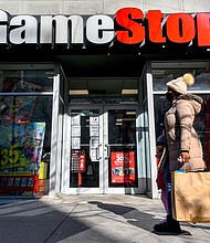 People walk by a GameStop store in Brooklyn on January 28, 2021 in News  Photo - Getty Images