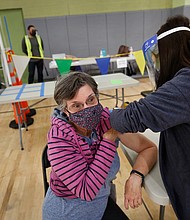 Substitute teacher Jane Golliver, 67, and other Los Angeles Unified School District employees received their first dose of the vaccine last week.
Credit:	Al Seib/Los Angeles Times/Getty Images