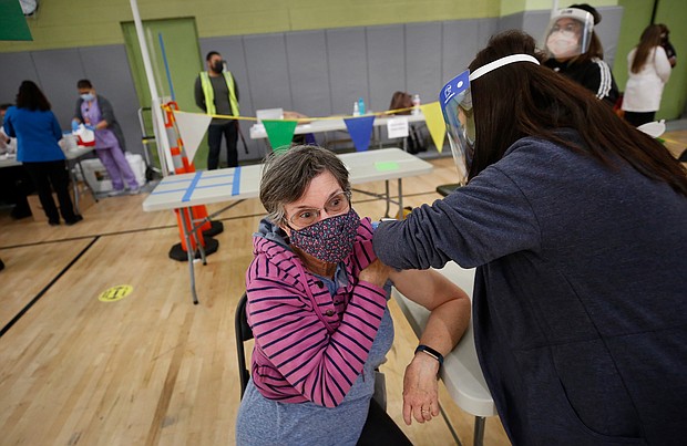 Substitute teacher Jane Golliver, 67, and other Los Angeles Unified School District employees received their first dose of the vaccine last week.
Credit:	Al Seib/Los Angeles Times/Getty Images