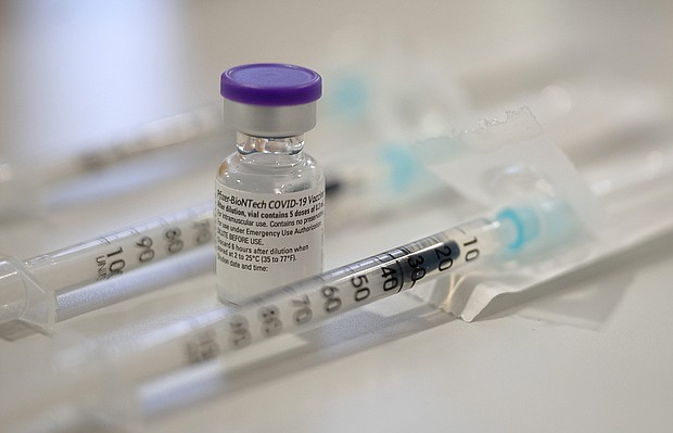 An ampoule containing the Corona vaccine from Biontech/Pfizer stands between syringes that have already been drawn up at the Bürgerheim retirement and nursing home.
Credit:	Sebastian Gollnow/picture alliance/Getty Images