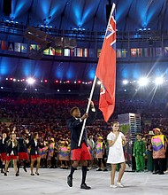 Tyrone Smith carries the flag for Bermuda during the opening ceremony of the Rio 2016 Olympics.
Credit:	Cameron Spencer/Getty Images
