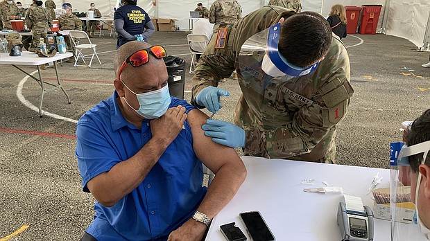 Guillermo Muñoz getting the J&J Covid-19 vaccine.
Credit:	Rosa Flores/CNN
