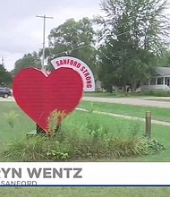 A heart sign says "Sanford Strong."  The community is working to line the streets with vendors in an effort to build back Sanford.
Credit:	WNEM