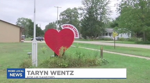 A heart sign says "Sanford Strong."  The community is working to line the streets with vendors in an effort to build back Sanford.
Credit:	WNEM