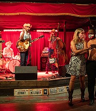 Lloyd Weatherspoon and Hope Wilson dance during a break between songs performed by Johnny McGowan's Rugged Gents at The White Horse on March 10 in Austin, Texas.
Credit:	Tamir Kalifa/Getty Images