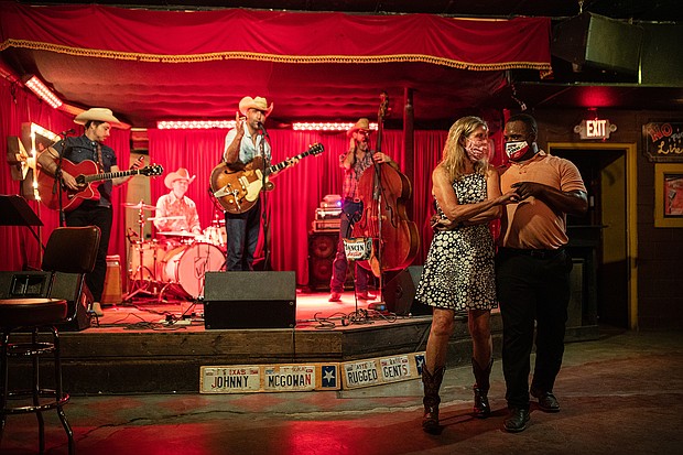 Lloyd Weatherspoon and Hope Wilson dance during a break between songs performed by Johnny McGowan's Rugged Gents at The White Horse on March 10 in Austin, Texas.
Credit:	Tamir Kalifa/Getty Images