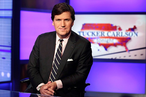 Tucker Carlson, host of "Tucker Carlson Tonight," poses for photos in a Fox News Channel studio on March 2, 2017, in New York.
Credit:	Richard Drew/AP