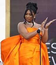 Megan Thee Stallion accepts the award for best new artist at the 63rd annual Grammy Awards at the Los Angeles Convention Center on Sunday, March 14, 2021.
Credit:	Chris Pizzello/Invision/AP