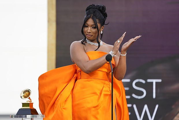 Megan Thee Stallion accepts the award for best new artist at the 63rd annual Grammy Awards at the Los Angeles Convention Center on Sunday, March 14, 2021.
Credit:	Chris Pizzello/Invision/AP
