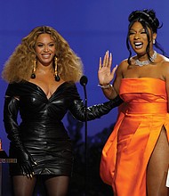 Beyonce, left, and Megan Thee Stallion accept the award for best rap song for “Savage” at the 63rd Annual Grammy Awards held Sunday at the Los Angeles Convention Center.