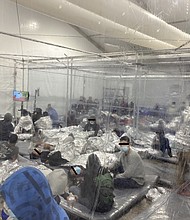 The Biden administration has not allowed journalists to independently visit the facilities, but several lawmakers have visited sites. Democratic Rep. Henry Cuellar provided these photos revealing the conditions for dozens of children and adults in an overflow facility in Donna, Texas.
Mandatory Credit:	Courtesy Rep. Henry Cuellar