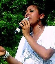 Jazmine Sullivan singing live at a concert in Columbia, SC on August 7, 2008.