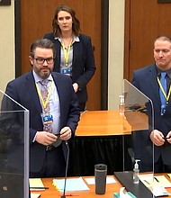 The second day of Derek Chauvin's trial in George Floyd's death is set to begin on March 30. Defense attorney Eric Nelson, left, defendant former Minneapolis police officer Derek Chauvin, right, and Nelson's assistant Amy Voss, back, are seen introducing themselves to jurors on March 22 at the Hennepin County Courthouse in Minneapolis.
Mandatory Credit: Court TV/Pool/AP