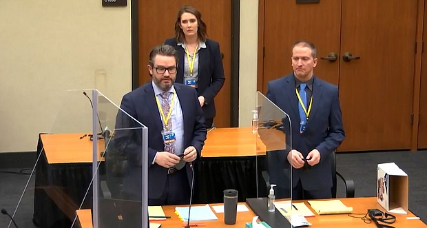 The second day of Derek Chauvin's trial in George Floyd's death is set to begin on March 30. Defense attorney Eric Nelson, left, defendant former Minneapolis police officer Derek Chauvin, right, and Nelson's assistant Amy Voss, back, are seen introducing themselves to jurors on March 22 at the Hennepin County Courthouse in Minneapolis.
Mandatory Credit:	Court TV/Pool/AP
