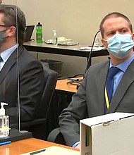 In this image from video, defense attorney Eric Nelson, left, and former Minneapolis police officer Derek Chauvin listen as Hennepin County Judge Peter Cahill presides over pre-trial motions prior to opening statements, Monday March 29, 2021, in the trial of Chauvin, in the May 25, 2020, death of George Floyd at the Hennepin County Courthouse in Minneapolis, Minn.
Mandatory Credit: Court TV via AP