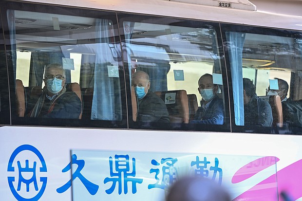 Members of the World Health Organization (WHO) team investigating the origins of the Covid-19 coronavirus pandemic leave The Jade Hotel on a bus after completing their quarantine in Wuhan on January 28.
Mandatory Credit:	Hector Retamal/AFP/Getty Images