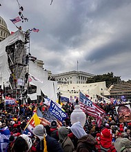 The mother of a police officer injured in the Capitol riot, seen here on Jan. 6, says she's outraged by Donald Trump's lie that his supporters were 'hugging and kissing' cops during the attack.
Mandatory Credit: Brent Stirton/Getty Images