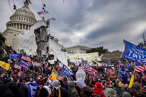The mother of a police officer injured in the Capitol riot, seen here on Jan. 6, says she's outraged by Donald Trump's lie that his supporters were 'hugging and kissing' cops during the attack.
Mandatory Credit:	Brent Stirton/Getty Images
