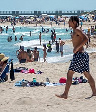 Biden administration officials are increasingly urging governors and local officials to reinstate or avoid relaxing public health restrictions as coronavirus cases continue to rise. People are shown spending spring break at the beach in Miami Beach, Florida, during the ongoing coronavirus pandemic.
Mandatory Credit:	Cristobal Herrera-Ulashkevich/EPA-EFE/Shutterstsock