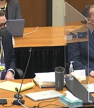 Hennepin County defense attorney Eric Nelson, left, and former Minneapolis police officer Derek Chauvin, right, listen as Judge Peter Cahill discusses motions before the court on March 30.
Mandatory Credit:	Court TV/Pool/AP