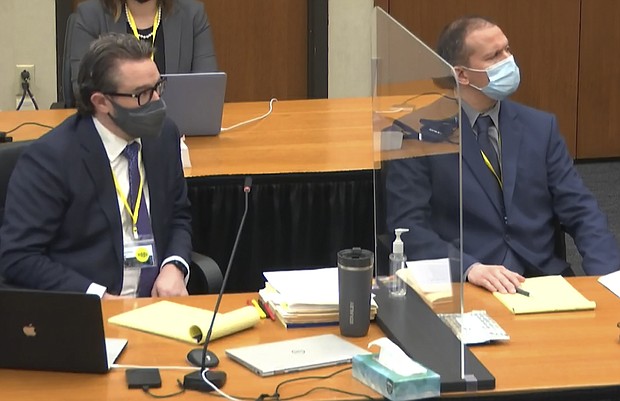 Hennepin County defense attorney Eric Nelson, left, and former Minneapolis police officer Derek Chauvin, right, listen as Judge Peter Cahill discusses motions before the court on March 30.
Mandatory Credit:	Court TV/Pool/AP