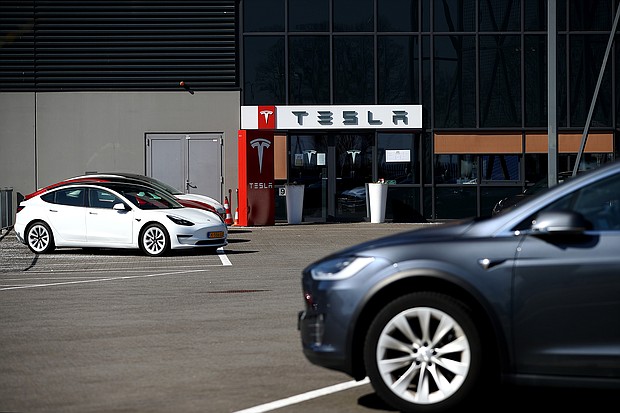 On April 2, Tesla revealed it did not build any of its two most expensive models, the Model S sedan and Model X SUV, in the first quarter. But it achieved a record number of deliveries of the less expensive Model 3 sedan and Model Y SUV in the same period.
Mandatory Credit:	Dean Mouhtaropoulos/Getty Images