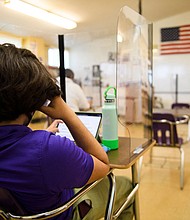There has been a worrisome trend emerging in recent weeks: Covid cases among younger people are rising. A student is shown at St. Anthony Catholic High School in Long Beach, California, March 24.
Mandatory Credit:	Patrick T. Fallon/AFP/Getty Images