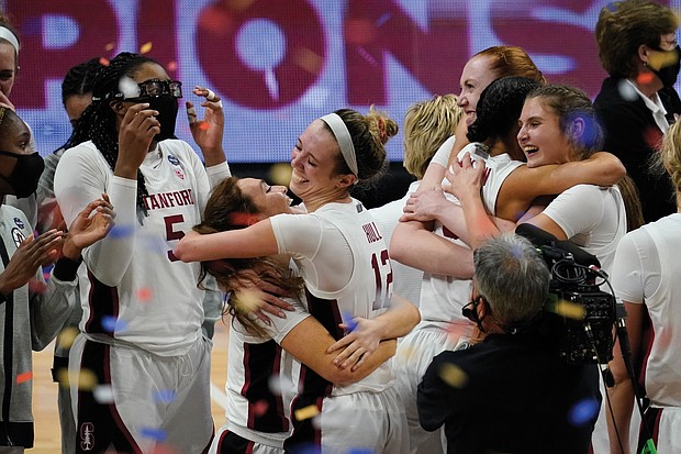 Stanford players celebrate after clinching the NCAA crown Sunday at the buzzer with a 54-53 victory over Arizona at the Alamodome in San Antonio, Texas.